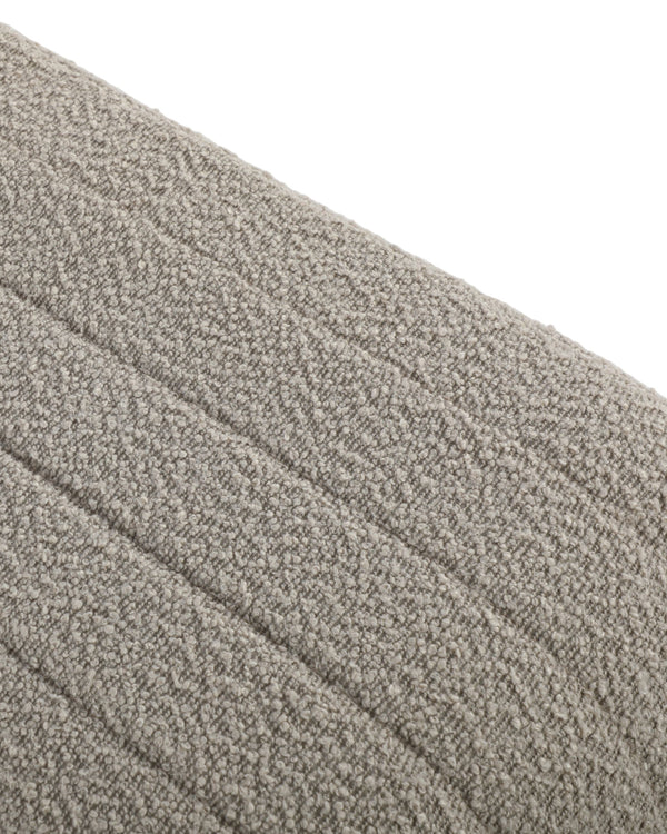 Close-up of the arched base cutout on the Arc Bench Large in Hazelnut Cream