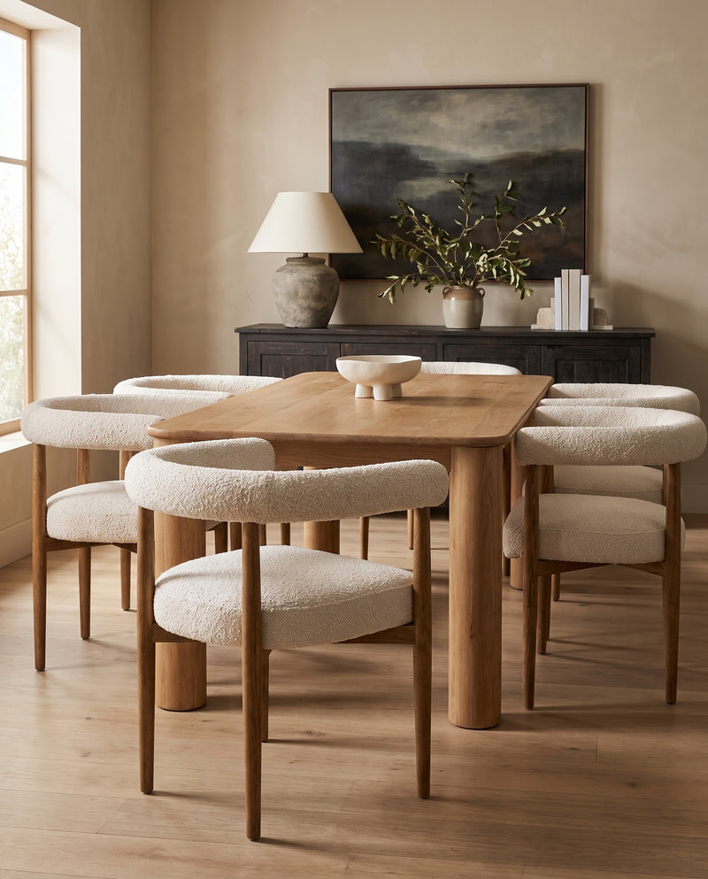 Amelie Dining Chairs in cream boucle around an oak dining table