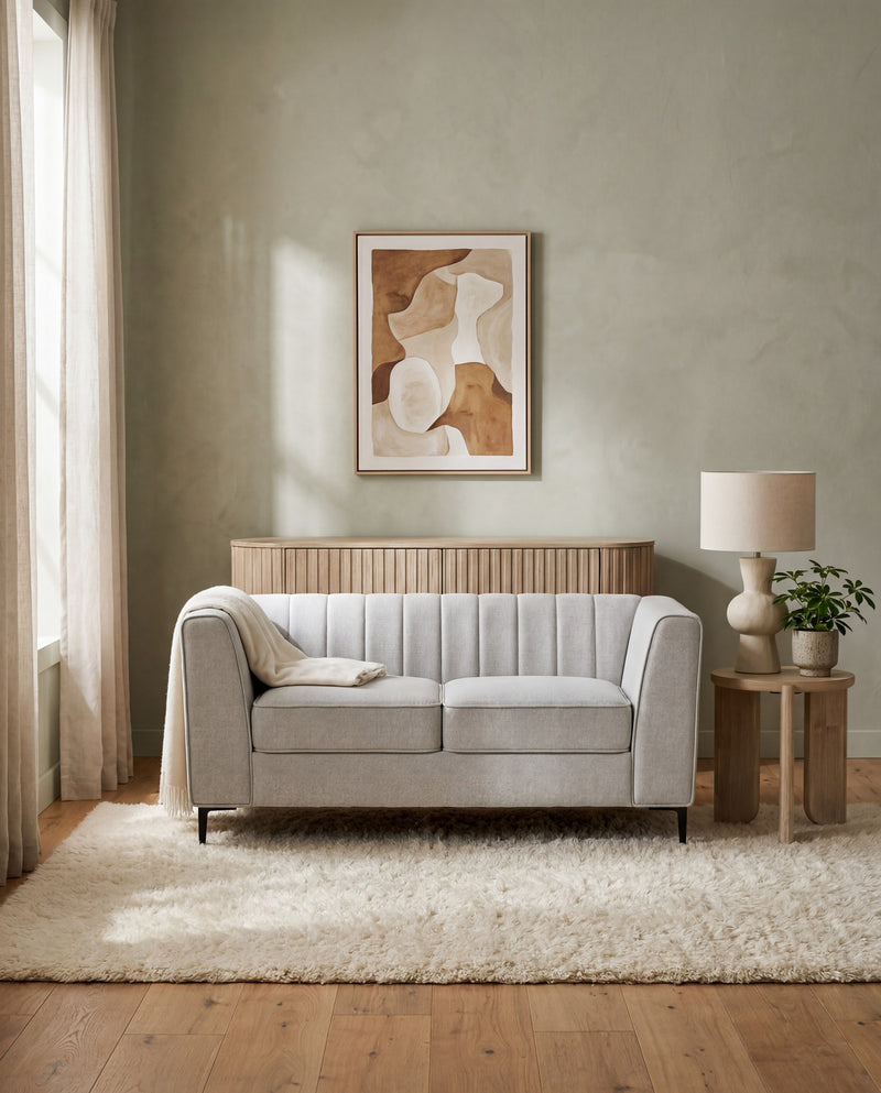 Enigma Loveseat in Oyster styled in a living room