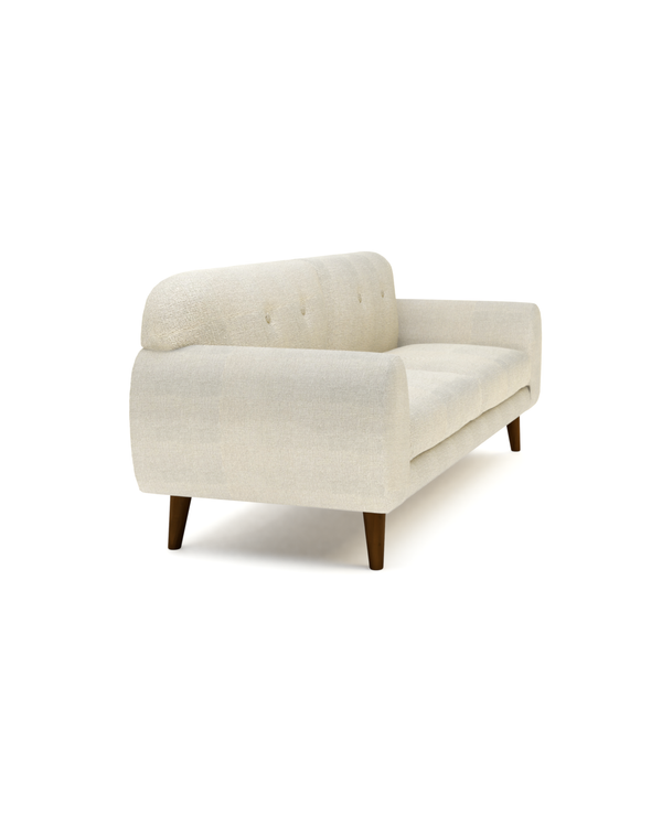 Upholstered Calia Sofa, three-quarter view with tufted back