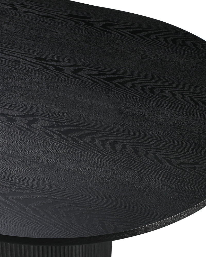 Close-up of the tabletop edge and fluted base on the Cydra Dining Table in Slate
