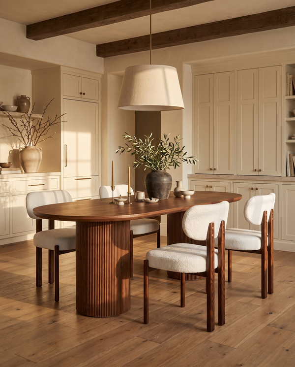 Cydra Dining Table in Walnut, styled in a room