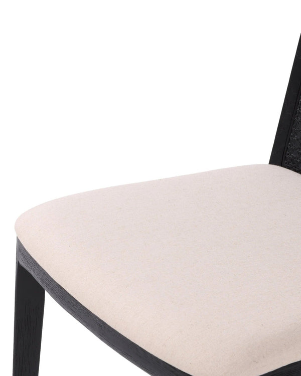 Close-up of the woven cane back on the Dario Dining Chair