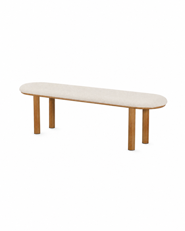 Ella Bench in Almond Cream with Oak-finish metal legs, three-quarter view showing the rounded seat