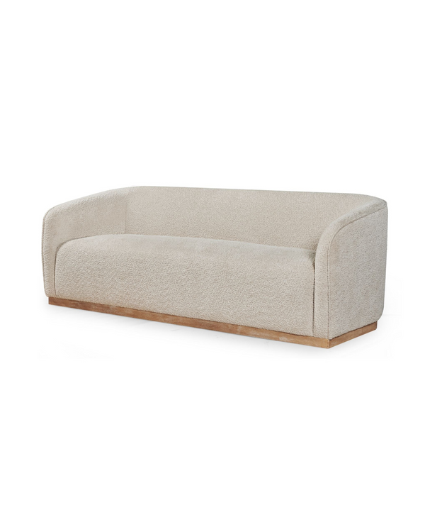 Sorelle Sofa in Almond Biscotti, three-quarter view with curved, wraparound back