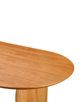 Aykah Ace Dining Table in Honey Oak, close-up of the wood grain and curved tabletop edge