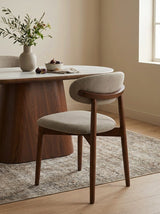 Bouclé Aires Dining Chair in London Fog styled in a dining room