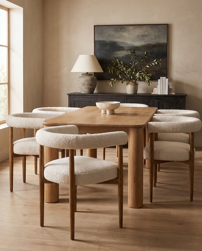 Amelie Dining Chairs in cream boucle around an oak dining table