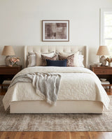 Upholstered Brittany Lift Up Storage Bed in a bedroom with natural light