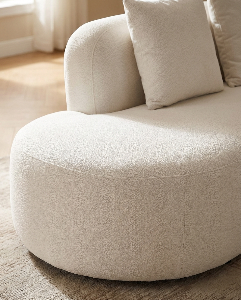 Elaan Sectional sectional sofa in White Chocolate styled with a coffee table