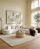 Elaan Sectional sectional sofa in White Chocolate in an open-plan living room