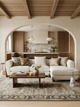 Bouclé Kova Sectional sectional sofa styled in a living room
