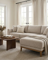Upholstered Liva Sectional sectional sofa in Natural Dune styled with a coffee table