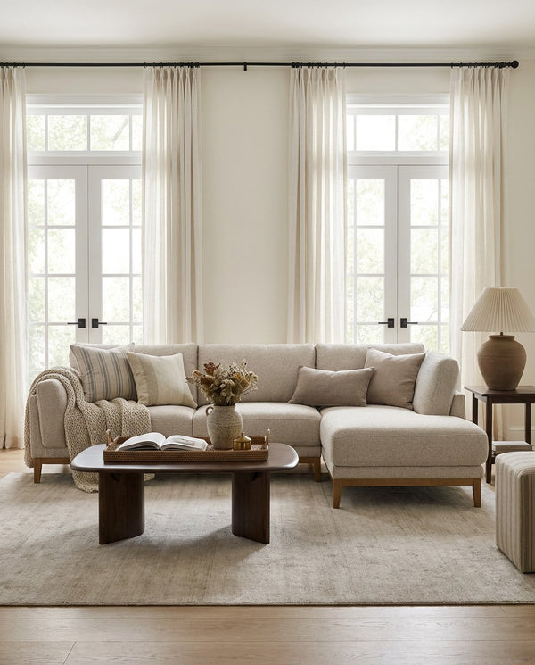 Upholstered Liva Sectional sectional sofa in Natural Dune styled in a living room