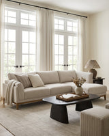 Upholstered Liva Sectional sectional sofa in Natural Dune in a living room with natural light