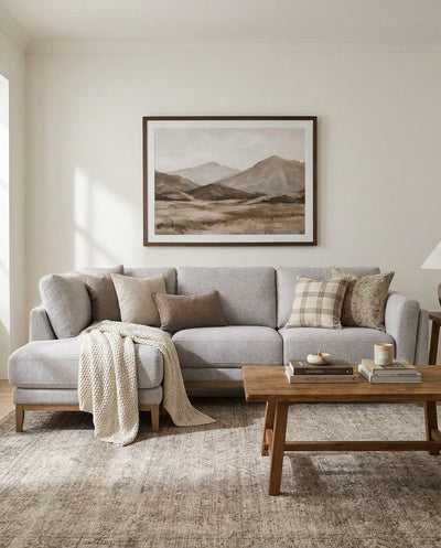 Upholstered Liva Sectional sectional sofa in Truffle Grey styled in a living room