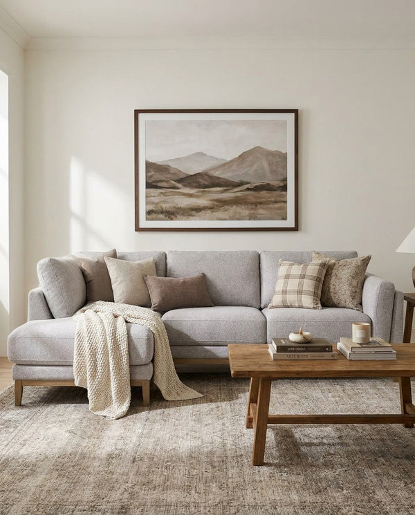 Upholstered Liva Sectional sectional sofa in Truffle Grey styled in a living room