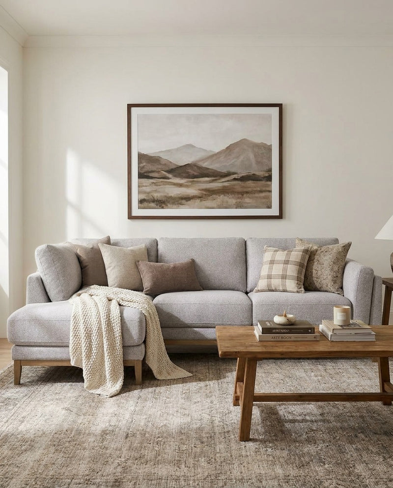 Upholstered Liva Sectional sectional sofa in Truffle Grey styled in a living room