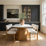 Lumera Dining Table in Warm Oak around a dining table