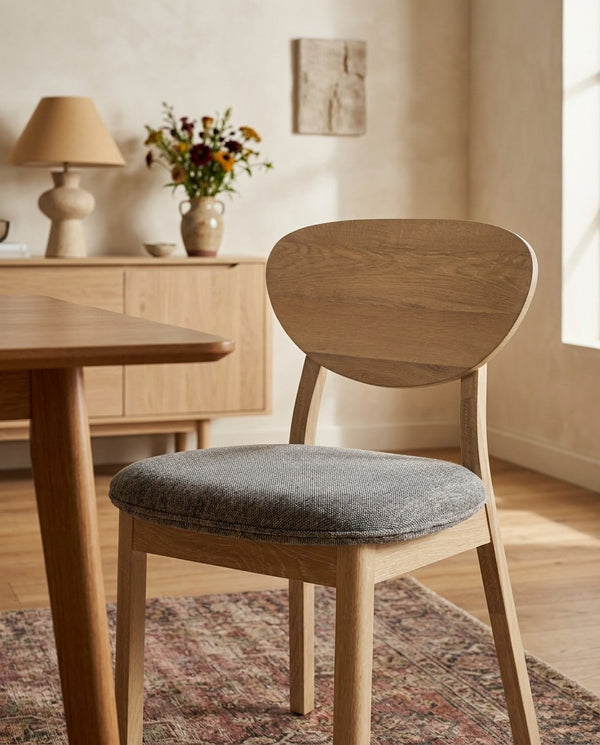 Upholstered Maeve Dining Chair around a dining table