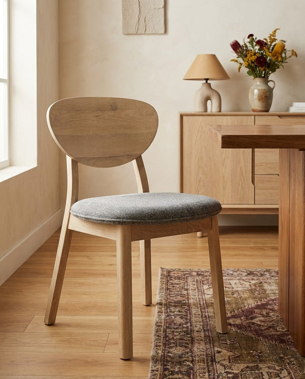 Upholstered Maeve Dining Chair styled in a dining room