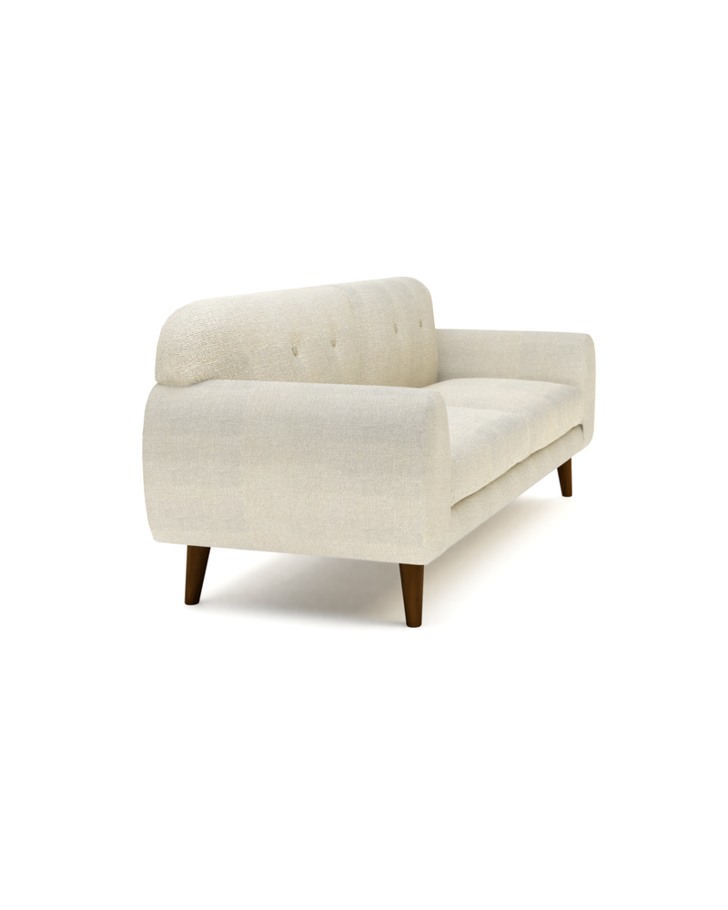 Upholstered Calia Sofa, three-quarter view with tufted back