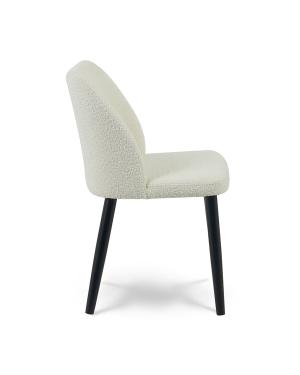 Capri Dining Chair in Moonlight Bouclé, side profile showing the curved backrest