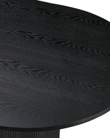Close-up of the tabletop edge and fluted base on the Cydra Dining Table in Slate