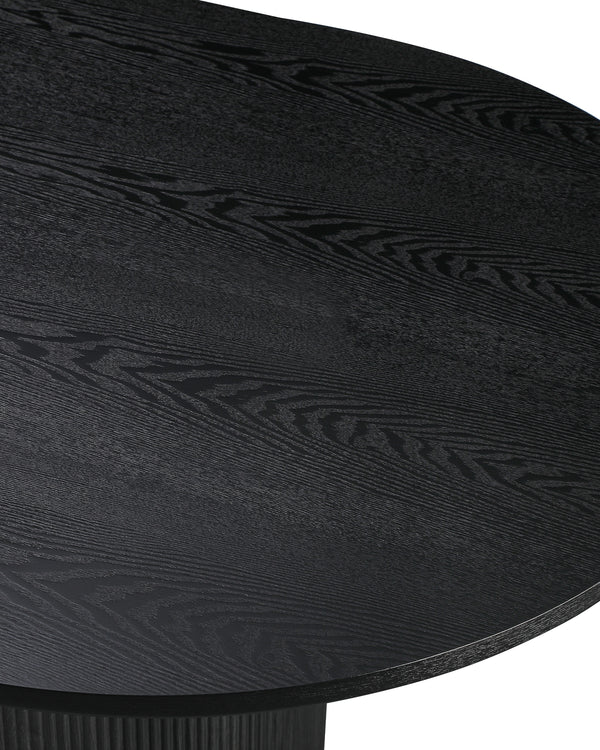 Close-up of the tabletop edge and fluted base on the Cydra Dining Table in Slate