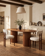 Cydra Dining Table in Walnut, styled in a room