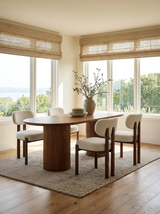 Cydra Dining Table in Walnut, styled in a room