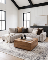 Aykah chenille Harmony Sectional in Oat Tweed, styled with a wood coffee table under a beamed ceiling