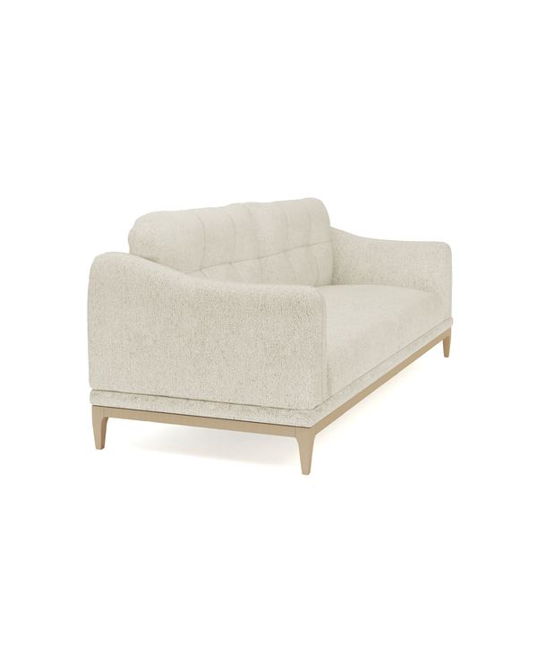 Upholstered Juno Sofa, three-quarter view with grid-tufted back