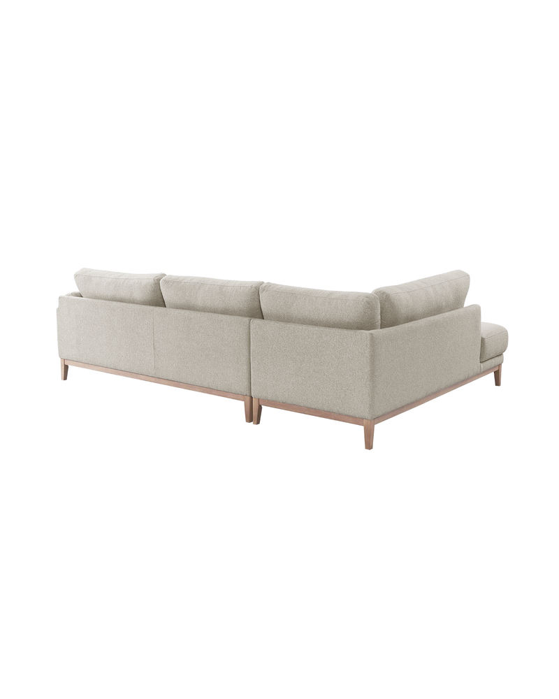 Upholstered Liva Sectional in Natural Dune, left facing, back view showing the finished reverse