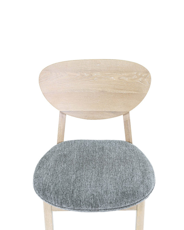 Upholstered Maeve Dining Chair, back view showing the finished reverse