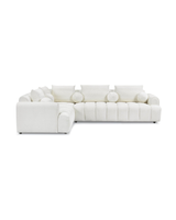 Bouclé Mellow Sectional in Cream Puff, left facing, three-quarter view showing seat depth