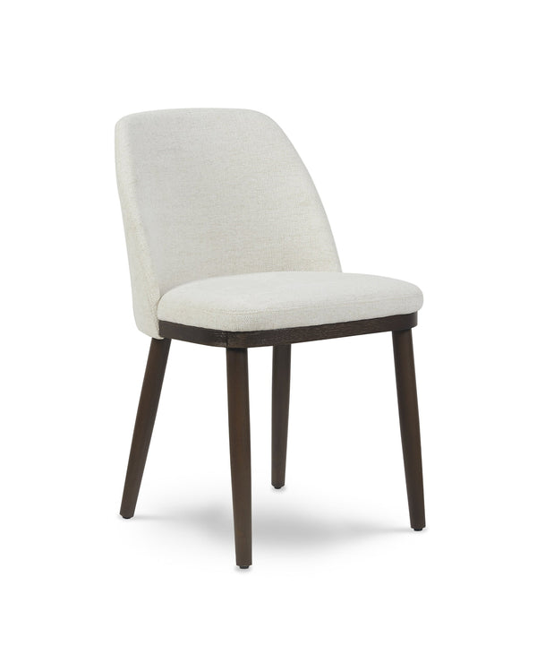 Raya Dining Chair in Cashmere Cream, three-quarter view with curved back