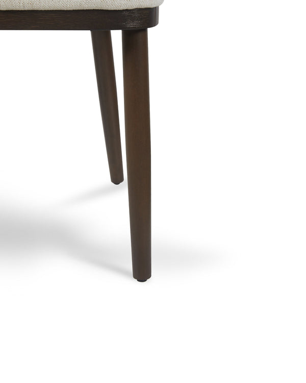Close-up of the curved back on the Raya Dining Chair in Cashmere Cream