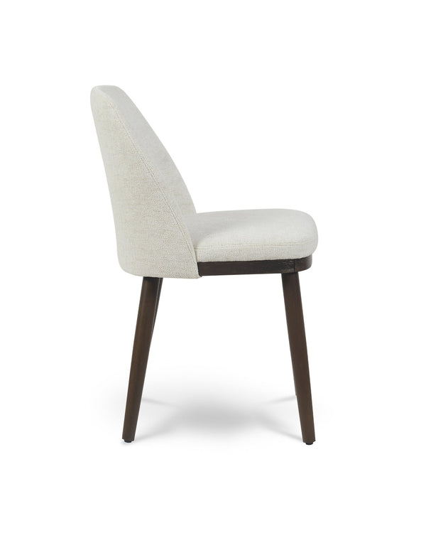 Raya Dining Chair in Cashmere Cream, side profile showing the curved back