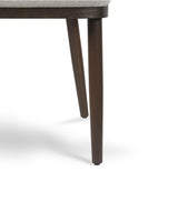 Close-up of the curved back on the Raya Dining Chair in Earl Grey