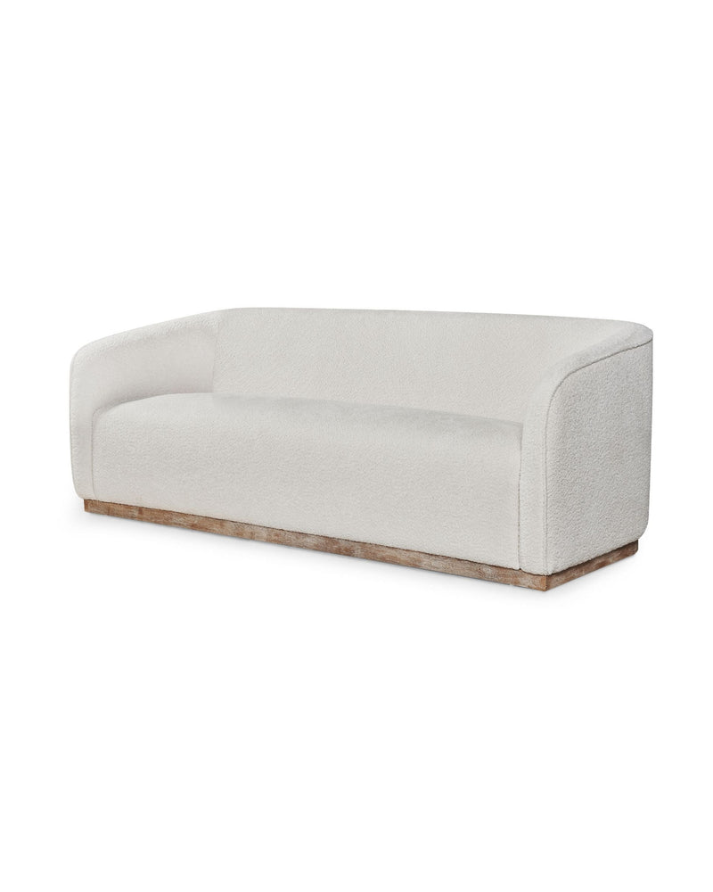 Sorelle Sofa in Bouclé Oyster, three-quarter view with curved, wraparound back